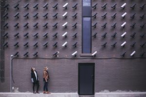 2 women looking at security cameras